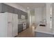 Well-equipped kitchen with stainless steel appliances, gray cabinets, and quartz countertops at 181 Longview Ave, Kissimmee, FL 34747