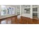 Hardwood floors in a bright living room with views of the kitchen at 181 Longview Ave, Kissimmee, FL 34747
