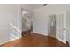 Spacious living room with hardwood floors and staircase leading to the second floor at 181 Longview Ave, Kissimmee, FL 34747