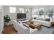 Comfortable living room with large windows, modern furniture and an area rug at 181 Longview Ave, Kissimmee, FL 34747