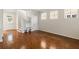 Spacious living room with hardwood floors, staircase, and built in shelving at 181 Longview Ave, Kissimmee, FL 34747