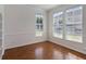 Bright and airy living room with hardwood floors and large windows at 181 Longview Ave, Kissimmee, FL 34747