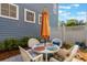 Outdoor patio area with dining table and umbrella at 181 Longview Ave, Kissimmee, FL 34747