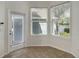 Bright sun room with tiled floor, a glass door, and two large windows at 181 Longview Ave, Kissimmee, FL 34747