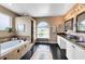 Spacious bathroom with a soaking tub, walk-in shower, and dual vanities at 2214 Westbourne Dr, Oviedo, FL 32765