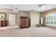 Bedroom space offering great potential with neutral walls, a window, a closet and a chandelier at 2214 Westbourne Dr, Oviedo, FL 32765