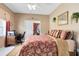 Comfortable bedroom with a desk area and a view into the living room at 2214 Westbourne Dr, Oviedo, FL 32765