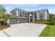 This gorgeous home boasts an attached three car garage, lush landscaping and grand curb appeal at 2214 Westbourne Dr, Oviedo, FL 32765