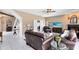 Inviting living room with comfortable seating, a fireplace, and access to other areas of the home at 2214 Westbourne Dr, Oviedo, FL 32765