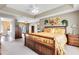 Spacious main bedroom with a tray ceiling, and views into a sitting area and bathroom at 2214 Westbourne Dr, Oviedo, FL 32765