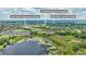 Aerial view of the community featuring a lake, sports complex, and tennis center at 245 Via Siena Ln, Lake Mary, FL 32746
