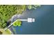 Aerial view of community pier with gazebo on a lake with lush greenery at 245 Via Siena Ln, Lake Mary, FL 32746