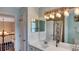 Stylish bathroom with double sinks, quartz countertops, and modern lighting at 245 Via Siena Ln, Lake Mary, FL 32746