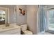 Bright bathroom with white vanity, toilet, shower, and neutral wall color at 245 Via Siena Ln, Lake Mary, FL 32746