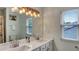 Modern bathroom with double sinks, quartz countertops, and updated fixtures at 245 Via Siena Ln, Lake Mary, FL 32746