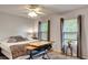 Comfortable bedroom with desk, perfect for studying, and natural light from the windows at 245 Via Siena Ln, Lake Mary, FL 32746