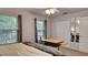 Bright bedroom with large windows and mirrored closet doors at 245 Via Siena Ln, Lake Mary, FL 32746
