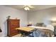 Cozy bedroom features a ceiling fan and comfortable furnishings at 245 Via Siena Ln, Lake Mary, FL 32746
