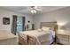 Comfortable bedroom with an alligator on the bed and large windows at 245 Via Siena Ln, Lake Mary, FL 32746