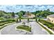 Gated community entrance featuring lush landscaping and controlled access for added security at 245 Via Siena Ln, Lake Mary, FL 32746