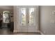 Elegant entryway featuring decorative glass double doors, allowing natural light to fill the space at 245 Via Siena Ln, Lake Mary, FL 32746