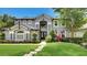 Stunning two-story home with a meticulously landscaped yard and elegant architectural details at 245 Via Siena Ln, Lake Mary, FL 32746