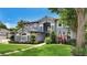 Stately two-story home boasts a manicured lawn and garden, as well as a charming neutral color palette at 245 Via Siena Ln, Lake Mary, FL 32746
