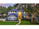 Stunning two-story home featuring a meticulously landscaped yard and elegant architectural details at 245 Via Siena Ln, Lake Mary, FL 32746