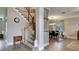 Inviting foyer with a staircase and view of the dining room, showcasing an open and airy layout at 245 Via Siena Ln, Lake Mary, FL 32746