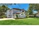 Charming two-story home featuring a well-manicured lawn and attached two-car garage at 245 Via Siena Ln, Lake Mary, FL 32746