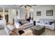 Open-concept living room featuring a fireplace, ample seating, and wood laminate flooring at 245 Via Siena Ln, Lake Mary, FL 32746