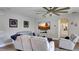 Bright living room with a ceiling fan, recessed lighting, a sofa, and a flat screen TV at 245 Via Siena Ln, Lake Mary, FL 32746