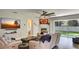 Comfortable living room featuring plush seating, ceiling fan, and large screen TV at 245 Via Siena Ln, Lake Mary, FL 32746