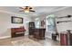 Open-concept living room with hardwood floors, piano, and bar, perfect for entertaining guests at 245 Via Siena Ln, Lake Mary, FL 32746