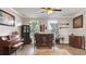 Living room featuring a piano, a home bar, a dark cabinet, and unique decorative art at 245 Via Siena Ln, Lake Mary, FL 32746