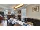 Open-concept dining and living areas featuring light wood floors and modern décor at 245 Via Siena Ln, Lake Mary, FL 32746