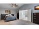 Comfortable main bedroom with an ensuite bathroom and neutral walls, offering a serene retreat at 245 Via Siena Ln, Lake Mary, FL 32746