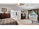 Spacious main bedroom featuring vaulted ceilings, ensuite bathroom and large window at 245 Via Siena Ln, Lake Mary, FL 32746
