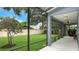 Inviting screened porch offers serene views of the expansive, beautifully landscaped backyard at 245 Via Siena Ln, Lake Mary, FL 32746