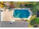Aerial view of a private backyard pool with a brick patio, surrounded by a wooden fence and mature trees at 2520 Chanute Trl, Maitland, FL 32751