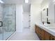 Modern bathroom with a glass enclosed shower with decorative tile and dual sink vanity at 2520 Chanute Trl, Maitland, FL 32751