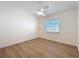 Bedroom features wood floors, a window, and modern touches at 2520 Chanute Trl, Maitland, FL 32751