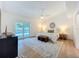 Vaulted ceiling bedroom with a large sliding glass door to backyard and wood floors at 2520 Chanute Trl, Maitland, FL 32751