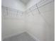 Walk-in closet features wood flooring and white walls at 2520 Chanute Trl, Maitland, FL 32751