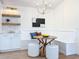 Charming breakfast nook with built-in bench seating, modern lighting, and decorative shelving at 2520 Chanute Trl, Maitland, FL 32751