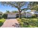 Beautiful single-story home with a brick driveway, well-manicured lawn, and inviting entrance, showcasing its curb appeal at 2520 Chanute Trl, Maitland, FL 32751