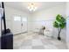 Bright foyer featuring marble tile flooring, modern light fixture, and a plant that adds a touch of nature at 2520 Chanute Trl, Maitland, FL 32751