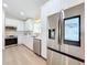 Spacious kitchen with stainless steel appliances, including a smart refrigerator, and white cabinets at 2520 Chanute Trl, Maitland, FL 32751