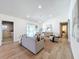 Comfortable living room featuring neutral tones, stylish furnishings, and sliding glass doors to the pool at 2520 Chanute Trl, Maitland, FL 32751