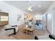 Open living room with ceiling fan, modern decor, view to the dining room and kitchen at 2520 Chanute Trl, Maitland, FL 32751